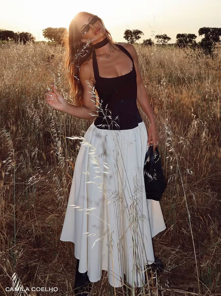 Person in sunglasses wearing a white shirt with '15' and 'The Lookout' text.