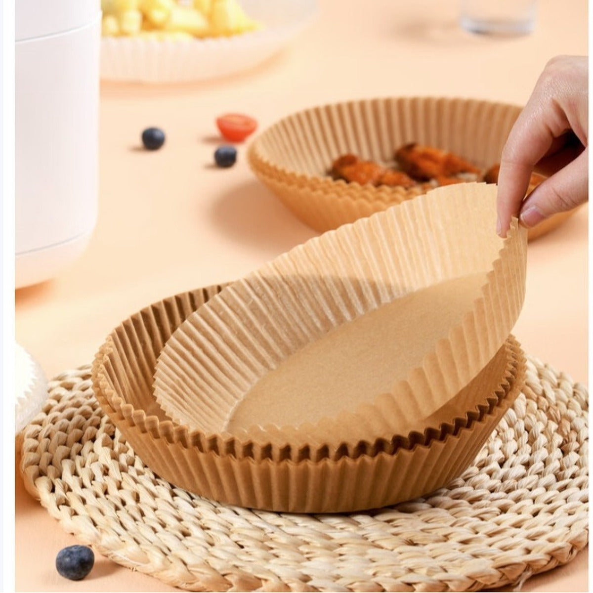 Crispguard paper liner placed inside an air fryer basket