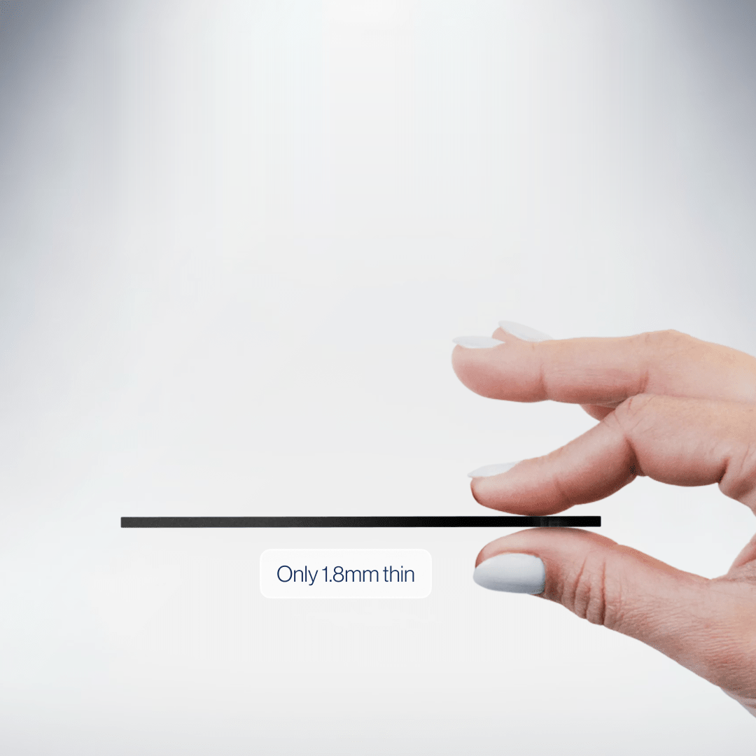 A hand pinching the Locca card to show it is only 1.8 mm thin