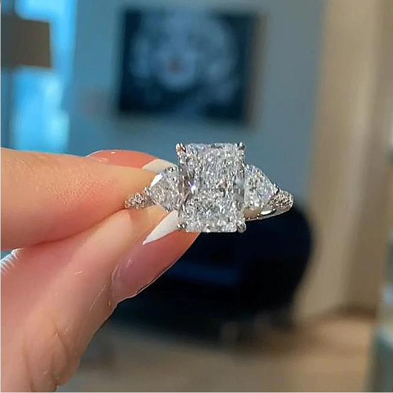Radiant Cut Three Stone Engagement Ring With Two Heart Cut Side Stones shine of diamond