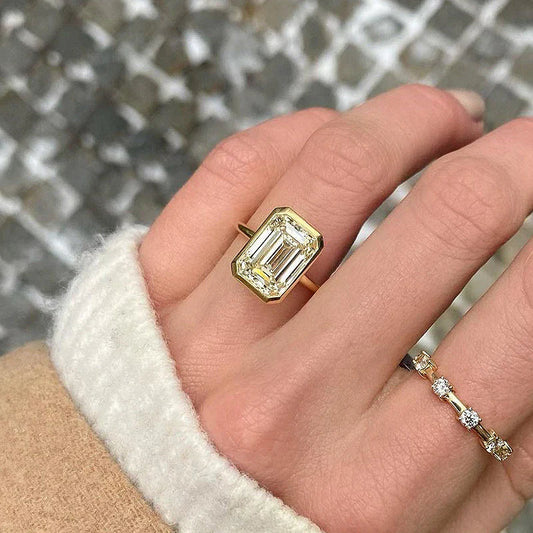 Elegant Emerald Cut Sterling Silver Bezel Engagement Ring In Golden Tone Shineofdiamond