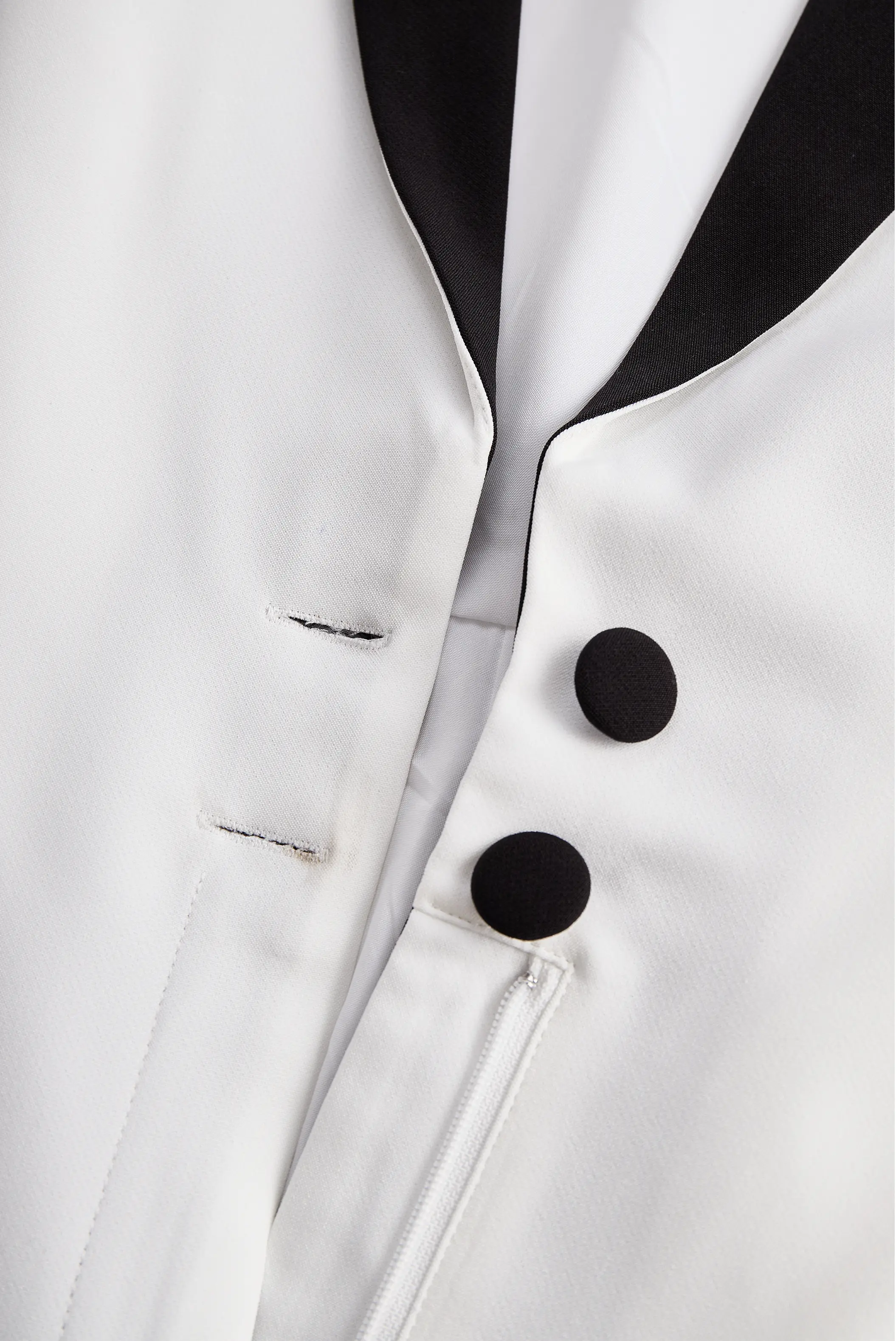Sleek White Jumpsuit with Black Lapel & Dual Buttons - Jumpsuit CASA LARO