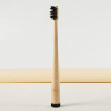 Gumcrest dark natural-bristle toothbrush front view