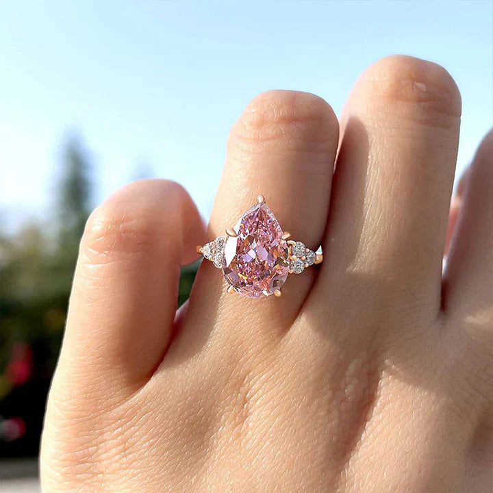 Pear Cut Pink Gemstone Three Stone Engagement Ring In Sterling Silver shine