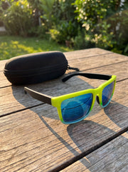 Kestryn sunglasses with their protective case on a sunlit table