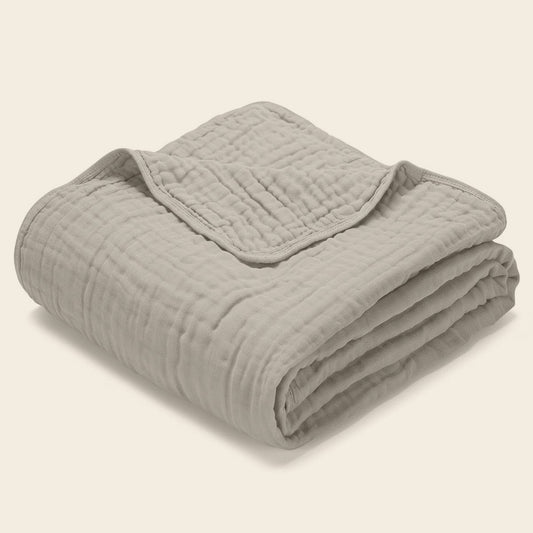 Morvelle Dune muslin cotton blanket folded on white