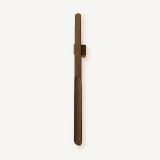 Norlund magnetic shoehorn in Dark Oak finish on its wall mount, full length