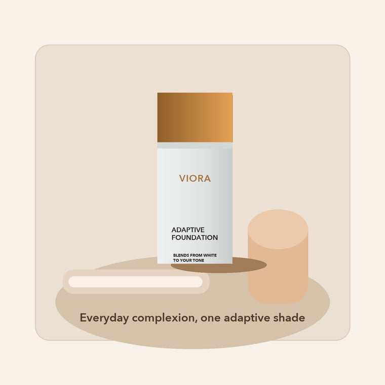 Viora foundation bottle on a vanity with a brush and mirror