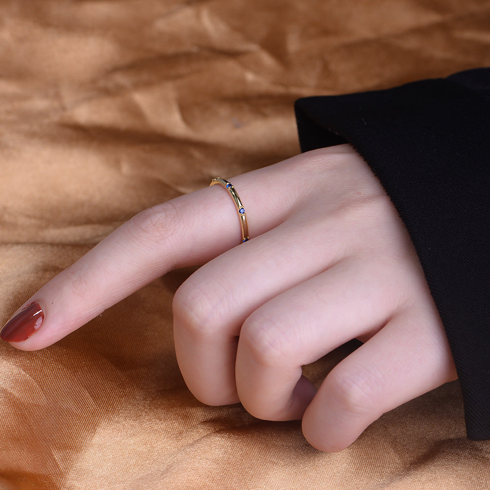 Stylish Golden Tone Wedding Band with Gemstone Accents Shineofidamond