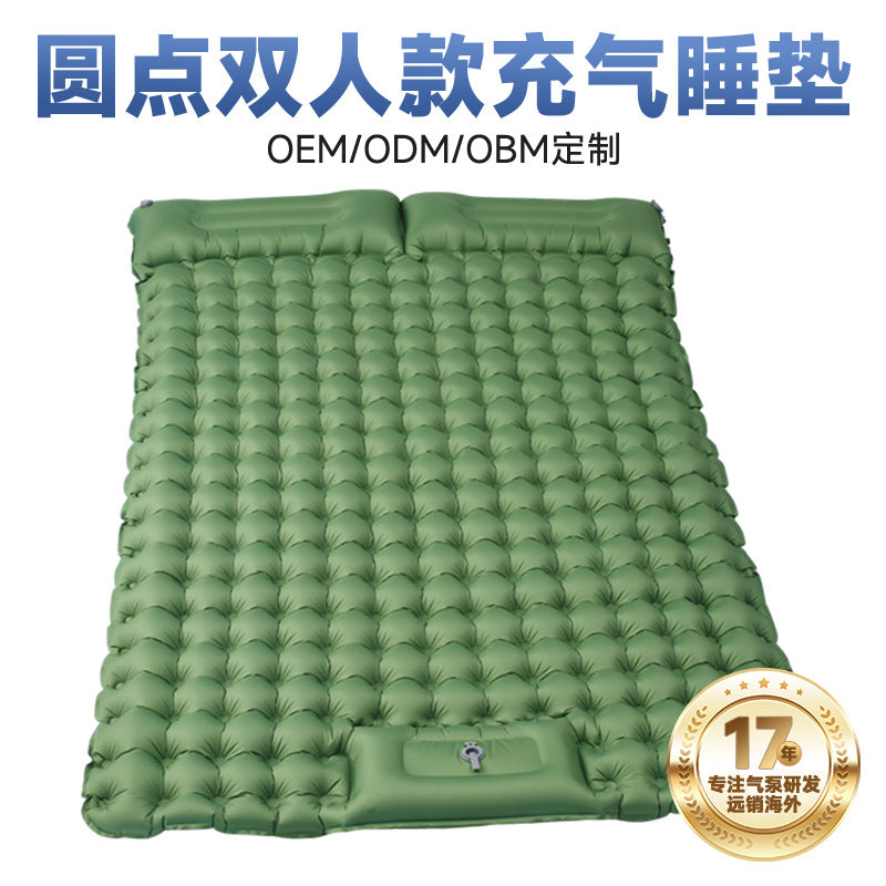 Green Valtro sleeping pad packed into its compact carry bag