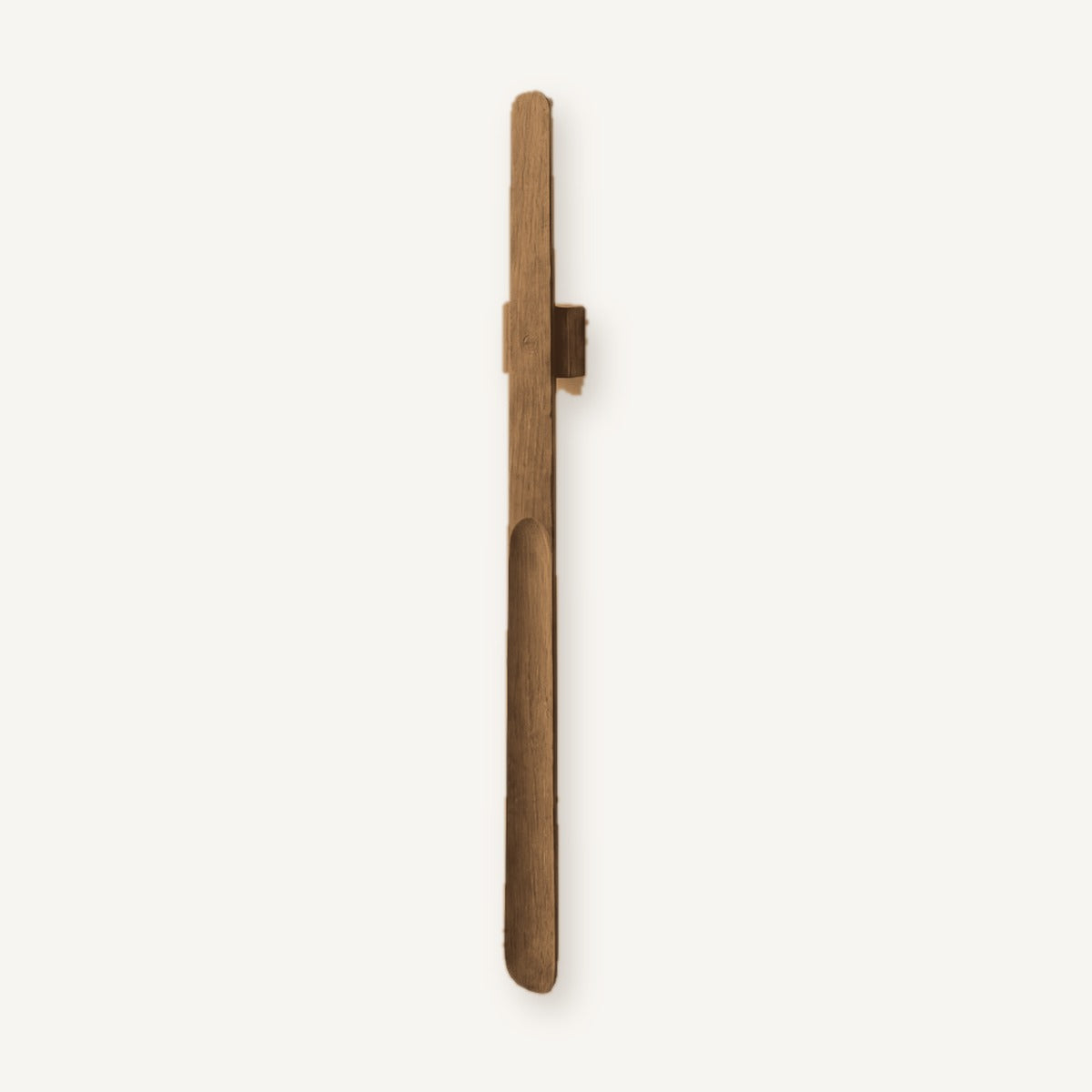 A solid walnut Norlund magnetic shoehorn on its wall mount, shown full length